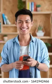 portrait-happy-asian-man-using-260nw-1641942466